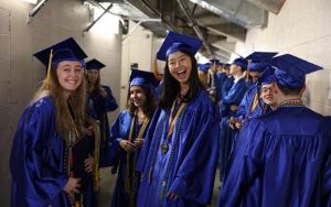  two smiling graduating seniors